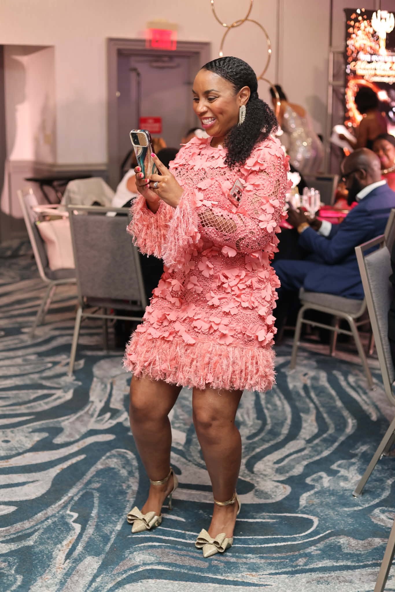 Guest in Pink Floral Dress at the Gala