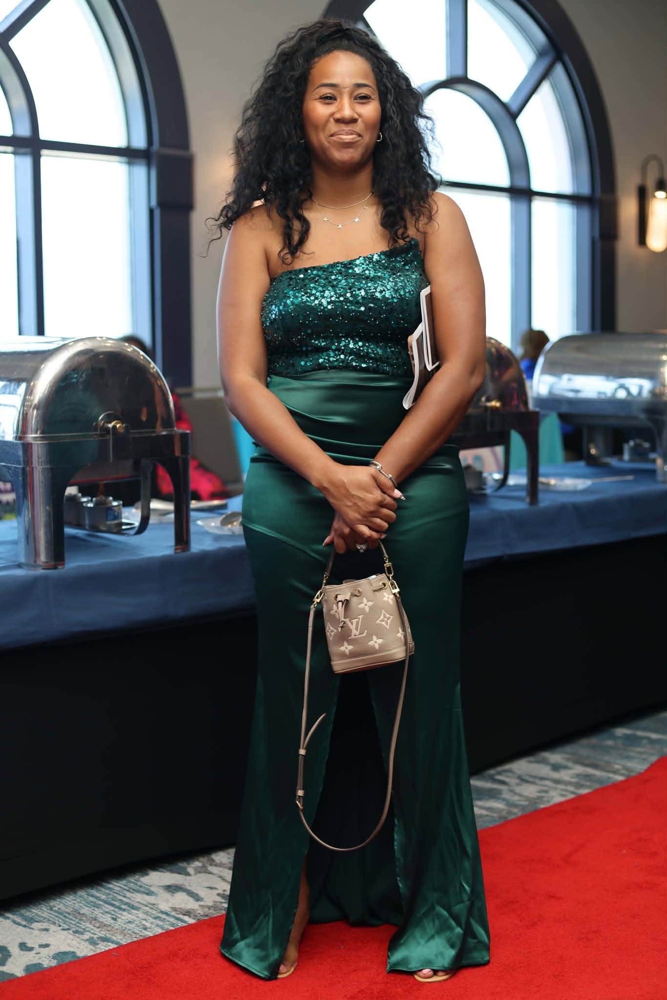 Attendee on the Red Carpet in Emerald Gown