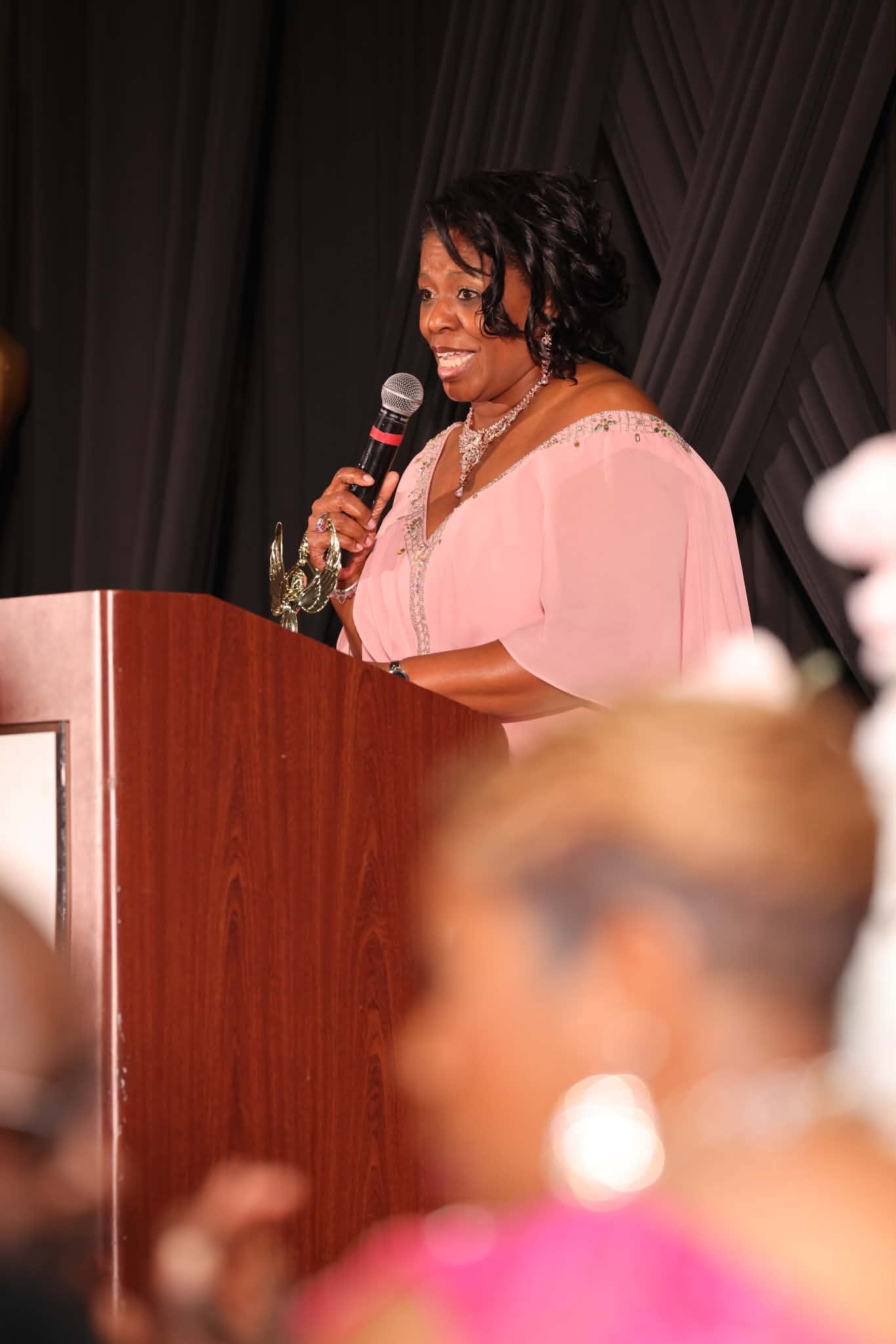 Speaker in Pink Gown at the Sheraton Podium